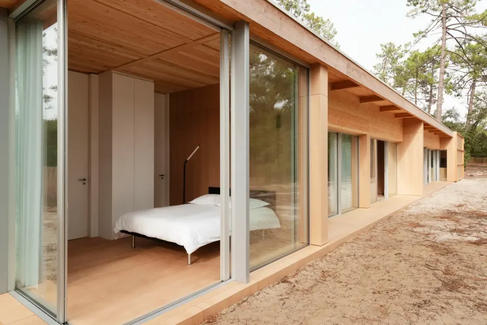 Villa Bedroom – Sliding Glass Facade, Timber-Lined Ceiling