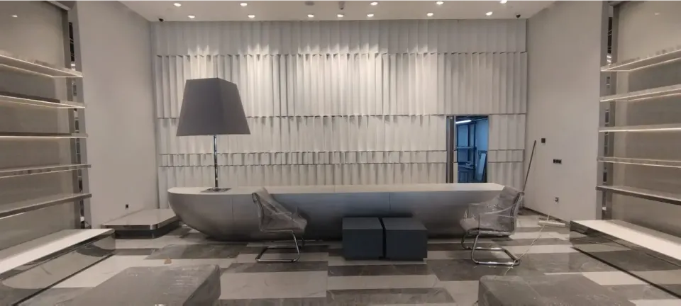 Store Interior – Boat-Shaped Grey Counter, Wavy Wall Panels