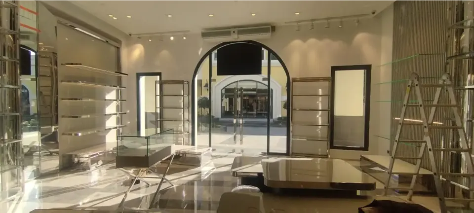 Store Interior – Arched Entrance, Chrome Shelving Display Units
