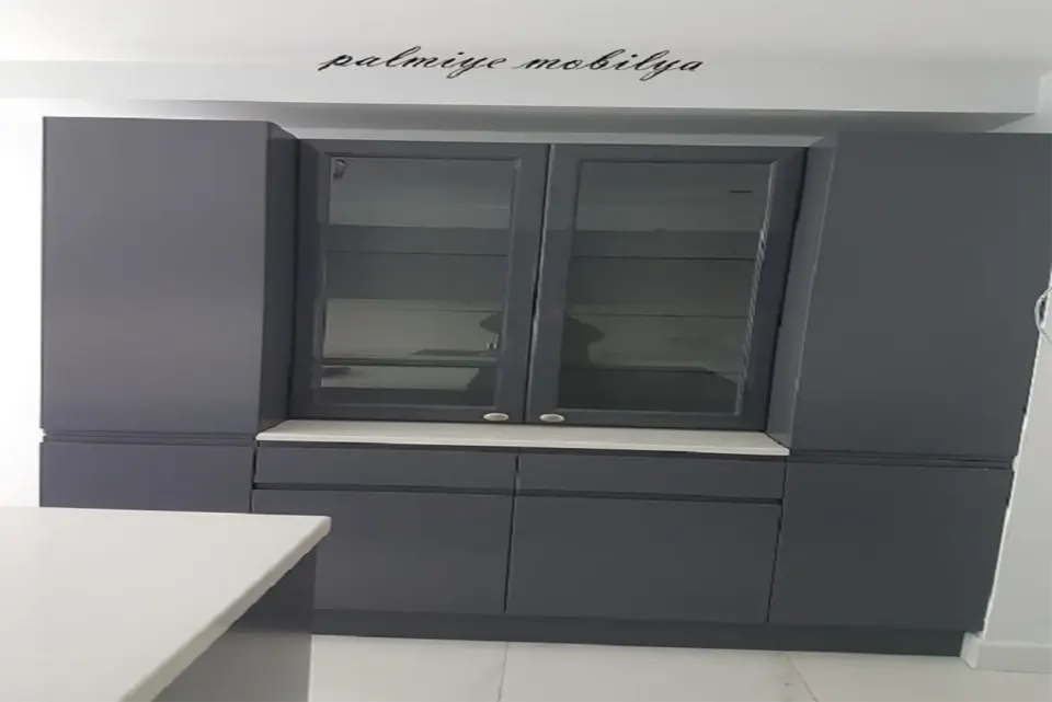 Anthracite kitchen dresser with glass-door display cabinet and white worktop