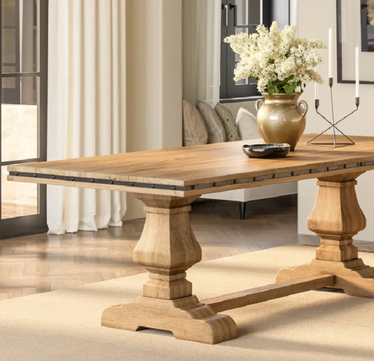 Nailhead-strap wooden dining table in a living room